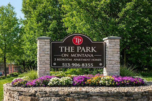 A sign for The Park on Montana, a 2 bedroom apartment complex, with a phone number listed.
