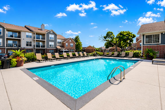 A patio with a table and chairs is set up for outdoor dining.