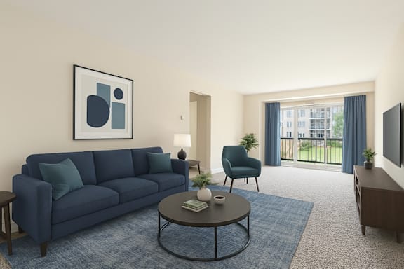 A living room with a blue couch, a coffee table, and a chair.