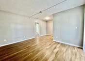 Thumbnail 5 of 5 - an empty living room with a hardwood floor at Lakeside @ Biscayne Gardens,North Miami, FL,33181