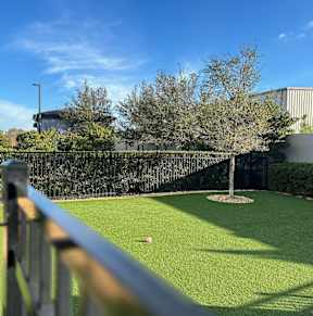 a patio with tables and chairs and a pool at The Oasis at 301 Apartments, Riverview, FL