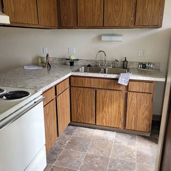 a bathroom with a sink and a toilet and a shower