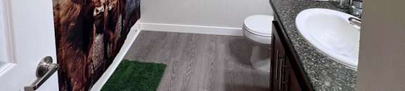 a bathroom with a shower and a sink and a toilet  at Mullan Reserve Apartments, Missoula, MT
