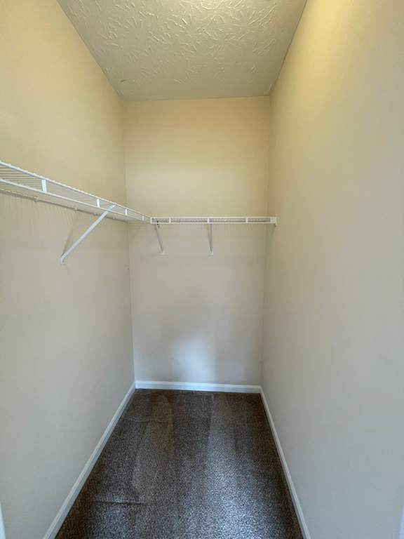 Empty hallway with a white coat rack.