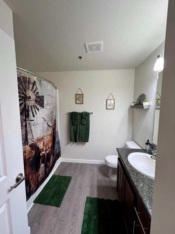 a bathroom with a shower and a sink and a toilet  at Mullan Reserve Apartments, Missoula, MT