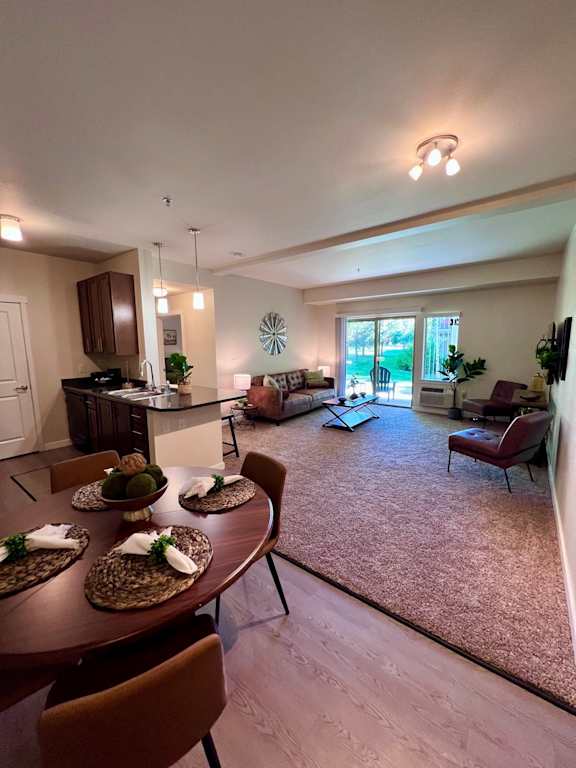 an open living room and dining room with a table and chairs at Mullan Reserve Apartments, Missoula, Montana