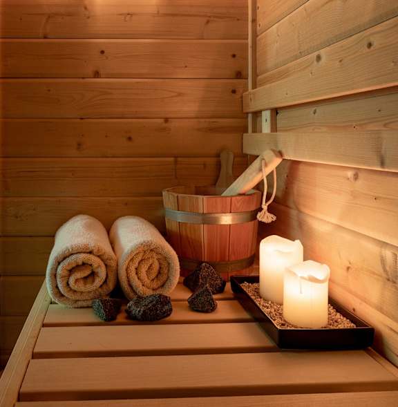 A wooden sauna with candles and towels. at 1700 California Street, San Francisco, 94109