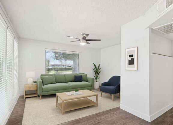 Living room with green couch at Palm Villas, Arizona, 85257