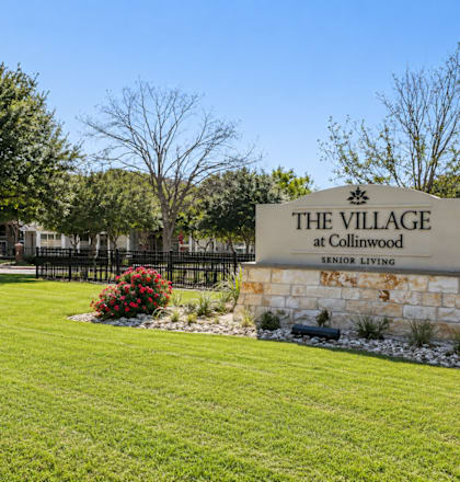 A sign for The Village at Collinwood senior living.