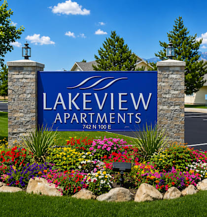 Lakeview Apartments sign with flowers in front.