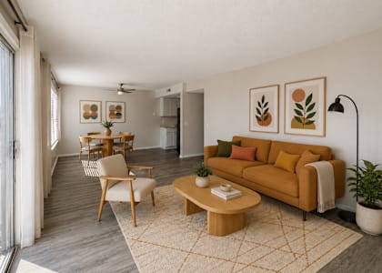 A living room with a couch, chair, and coffee table.