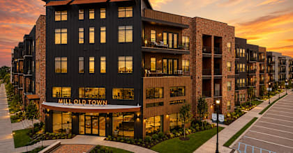 A modern building with the words "MILL OLD TOWN" on the front.