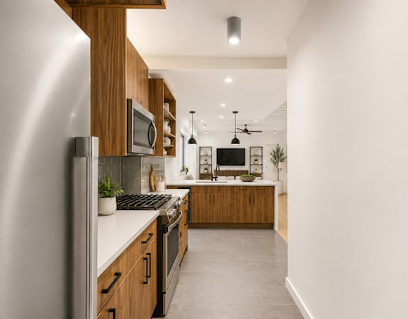 A modern kitchen with wooden cabinets and stainless steel appliances.