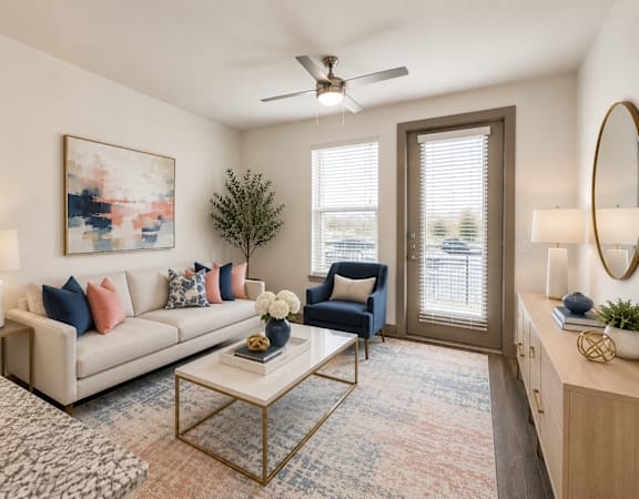 Modern apartment living room with comfortable seating, large windows, and contemporary finishes at One Preston Station Apartments in Celina, Texas.