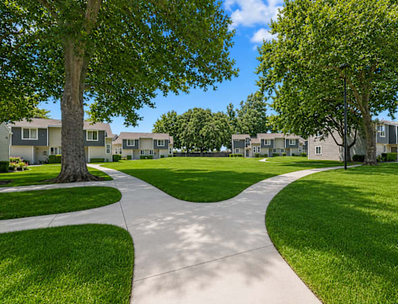 A residential area with a pathway and houses.