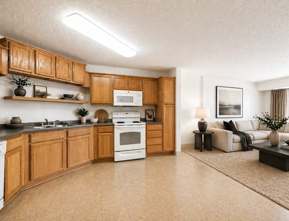 A modern kitchen with wooden cabinets and a white oven.