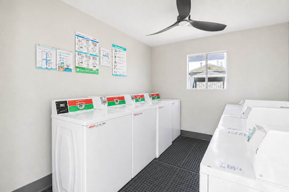 A row of washing machines in a laundromat.