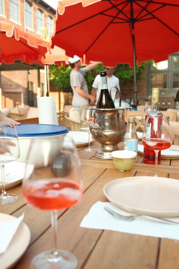 a table at a restaurant with a glass of wine on it