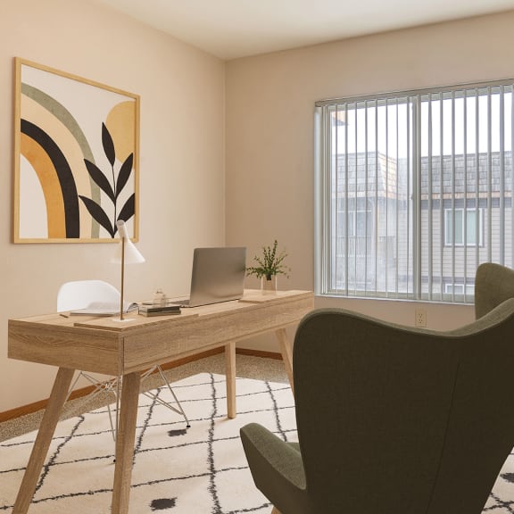 a home office with a desk and a chair and a window