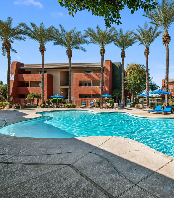 Community Swimming Pool with Pool Furniture at Saratoga Ridge Apartments located in North Phoenix, AZ-SMLAM.
