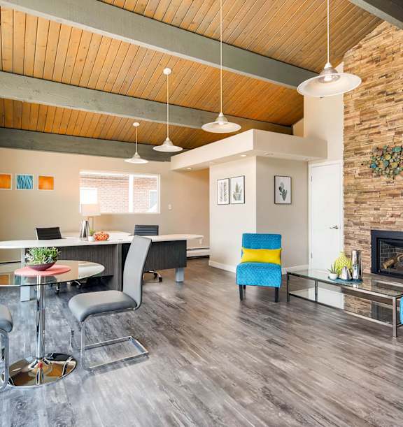A modern living room with a fireplace and a dining table.
