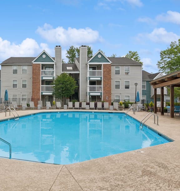 Community Swimming Pool with Pool Furniture at Park 2300 Apartments in Charlotte, NC-WELCOME.
