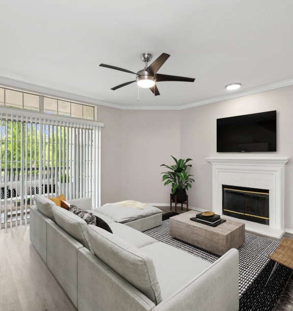 Model Living Room with Wood-Style Flooring, Fireplace & Patio Accessibility at Allure North Dallas Apartments located in Dallas, TX-WELCOME.