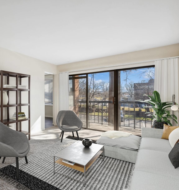 Model Living Room with Carpet and Patio Accessibility at Spring Parc Apartments in Silver Spring, MD-WELCOME.