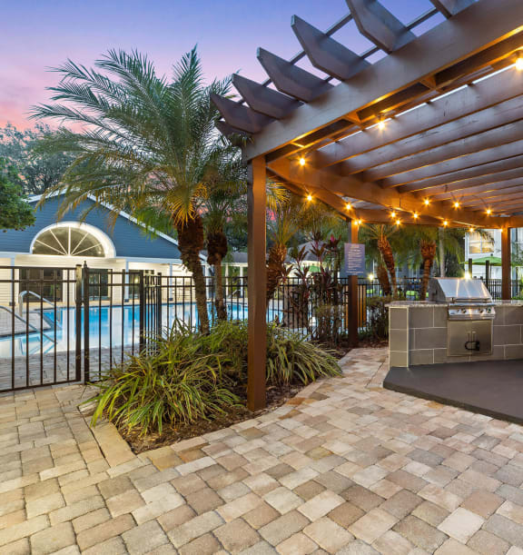 Outdoor BBQ Area with Canopy at Retreat at Crosstown Apartments in Riverview, FL-WELCOME.