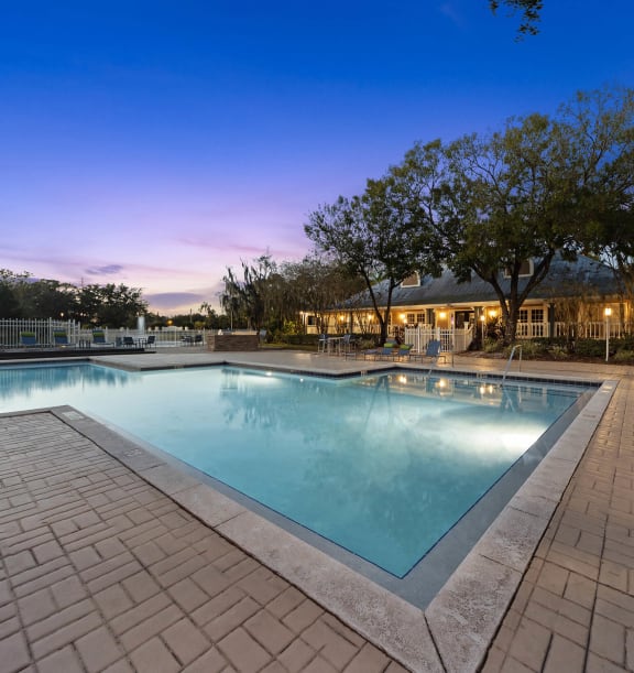Community Swimming Pool with Pool Furniture at Walden Lake Apartments in Plant City, FL-WELOME.
