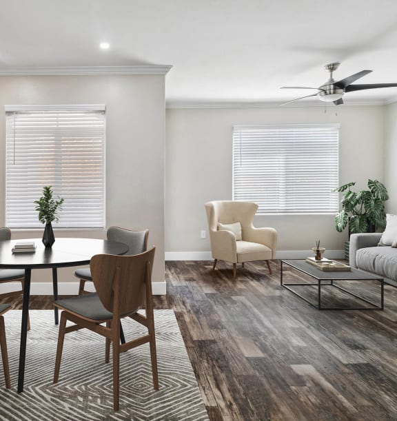 Model Dining/Living Room with Wood-Style Flooring at Reserve at Rancho Apartments located in Moreno Valley, CA-WELCOME.