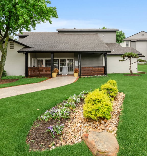 Exterior Community Building and Landscape at Cobblestone Apartments in Arlington, TX-WELCOME.