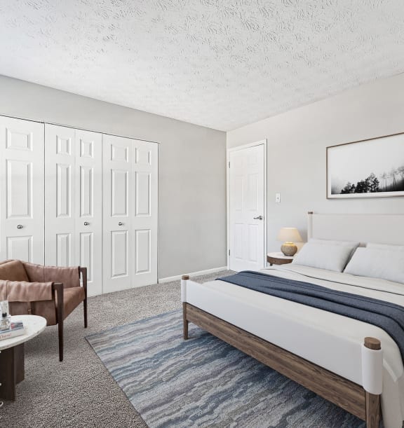 Model Bedroom with Carpet and Double Closets at Paramont Apartments in Duluth, GA-WELCOME.