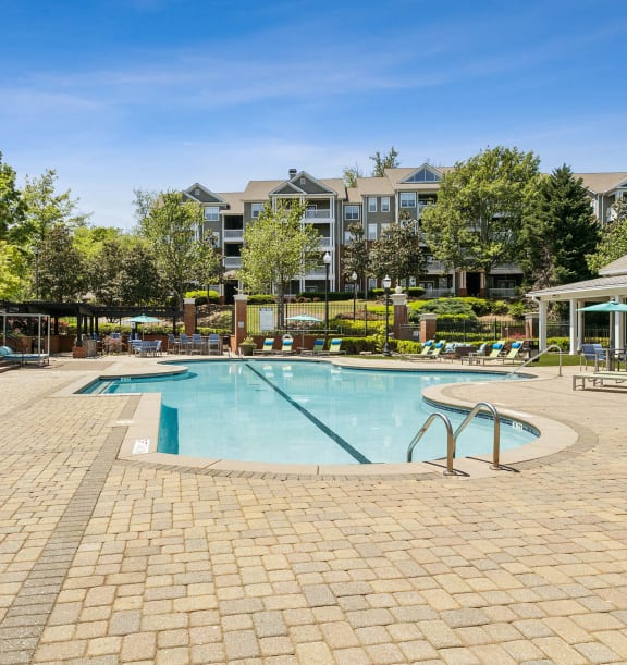 Community Swimming Pool with Pool Furniture at Parkside at Town Center Apartments in Marietta, GA-WELCOME.