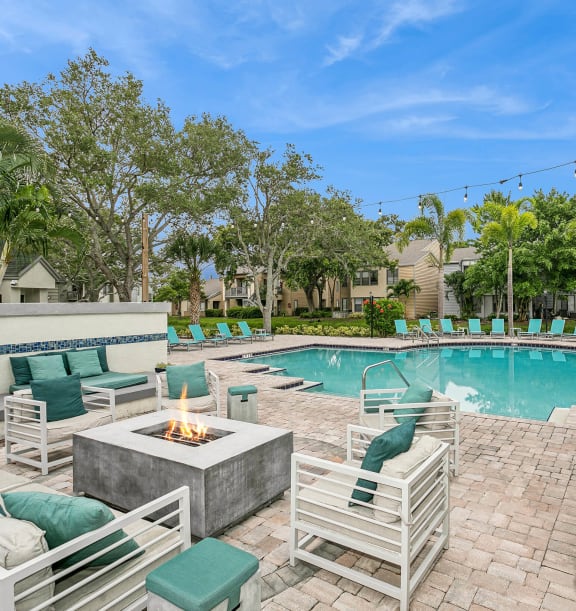 Apartments surrounding private lake with fountain at Huntington Place Apartments in Sarasota, Florida