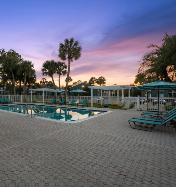 Community Swimming Pool with Pool Furniture at Park at 7200 Apartments in Jacksonville, FL-WELCOME.