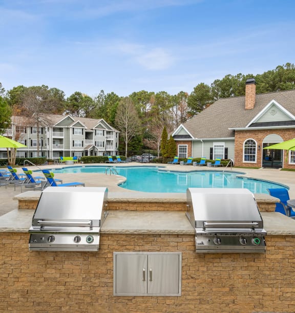 Community Swimming Pool Area with BBQ at Shadow Ridge Apartments in Riverdale, GA-WELCOME.