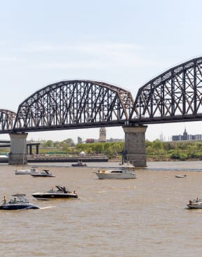 a group of boats in the water under a bridgeat The Slate, Jeffersonville, IN 47130