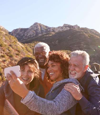 a group of people posing for a picture on a hike
