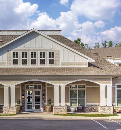 A building with a stone pillar on each side of the entrance.