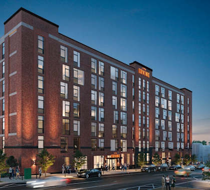 a rendering of a tall brick building on a city street at The Irvine, Philadelphia