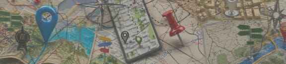 A map with a red pin and a blue pin on it.