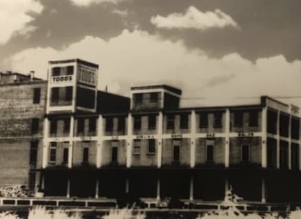 an old black and white photo of a building