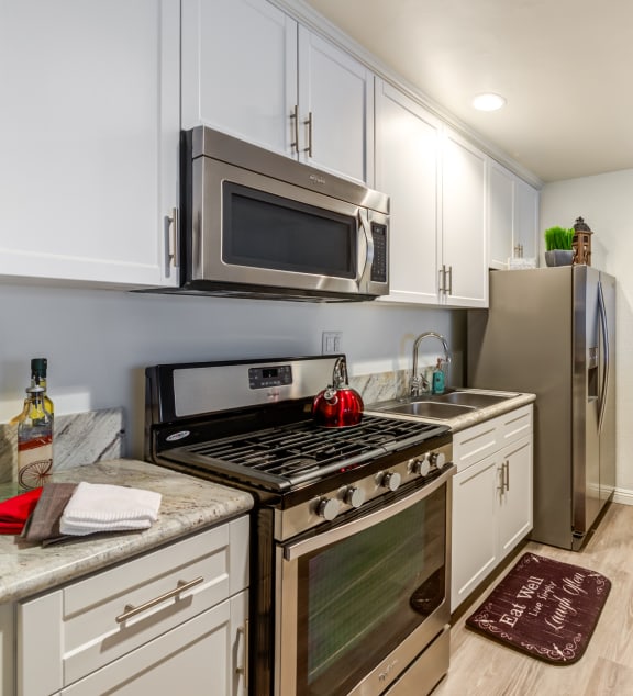 a home office with a desk and a table with chairs  at Mediterranean Village West Hollywood, West Hollywood, CA, 90069