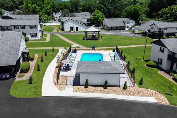 A house with a pool in the backyard.
