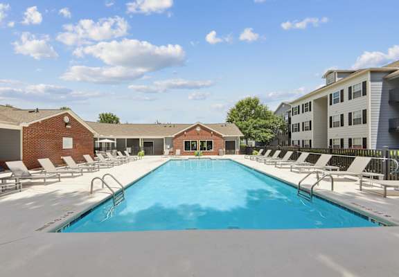 Resort-style swimming pool at Lancaster Place Apartments in Calera, AL with spacious sundeck and lounge seating near Shelby County and I-65.
