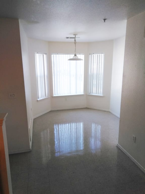 Image of space with large windows and light overhead