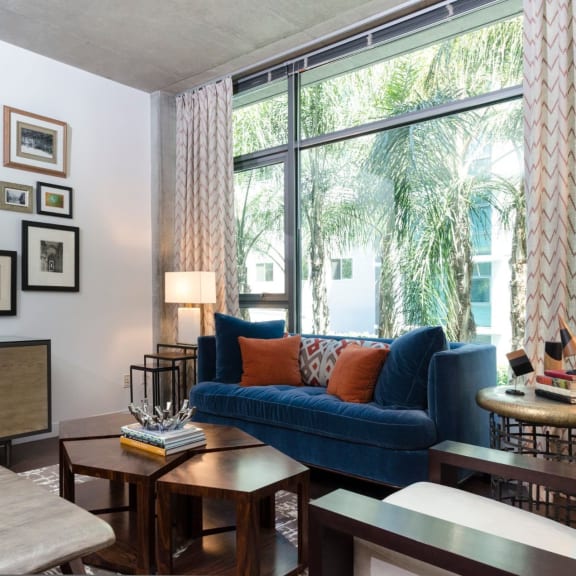 Living room with large windows at Met Lofts in Los Angeles, CA 90015