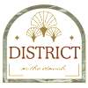 A logo with the text at District on the Etowah Apartments, Canton