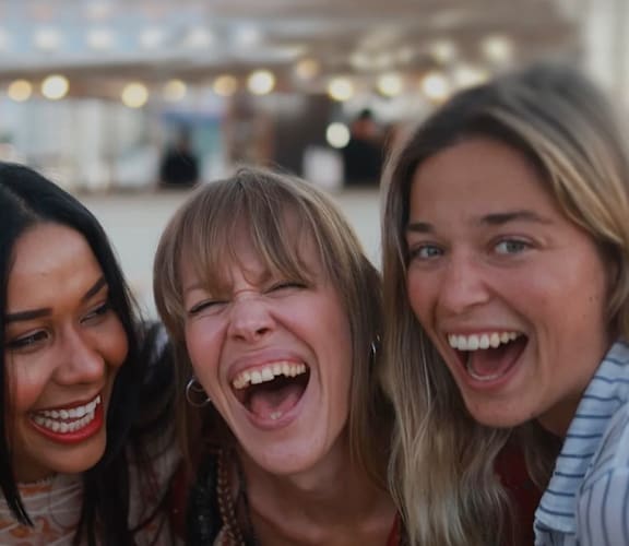 a group of women laughing and having funat Coach House Apartments, Missouri